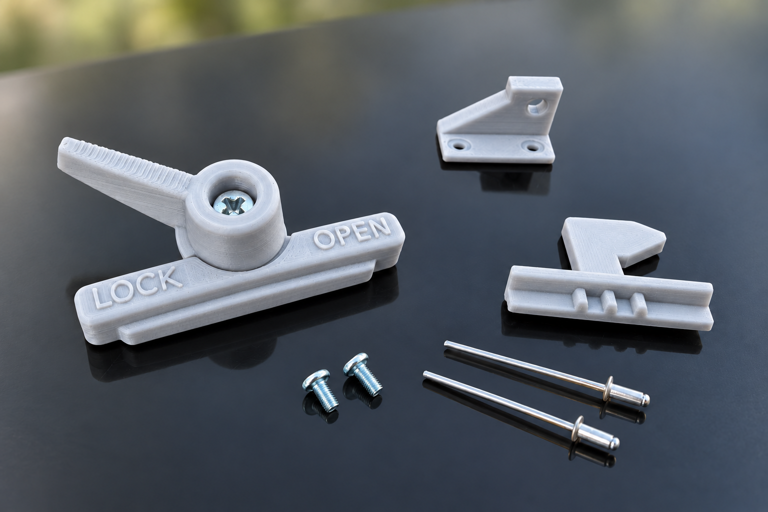 Light-grey body and handle assembly with the hook, catch, screws and rivets.